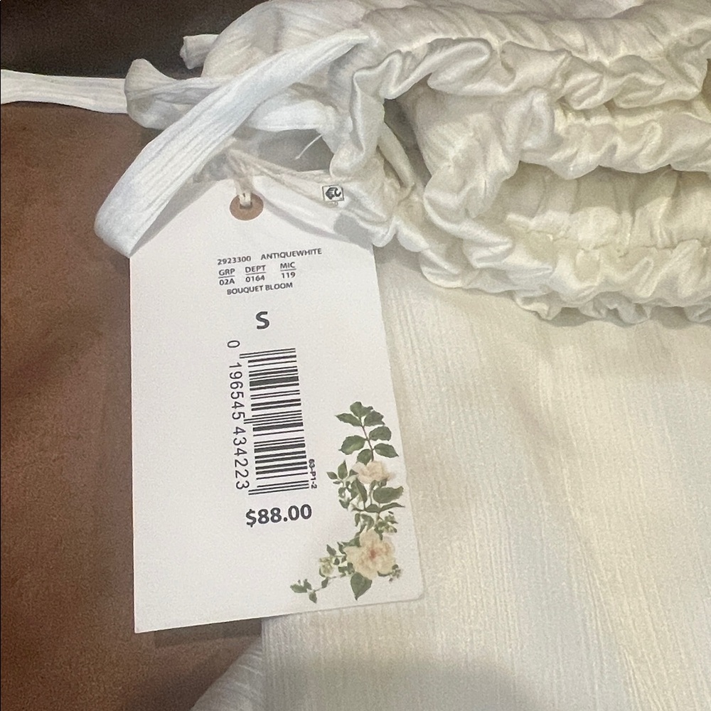 Chelsea & Violet Ivory Ruffled high waisted wide leg pants.